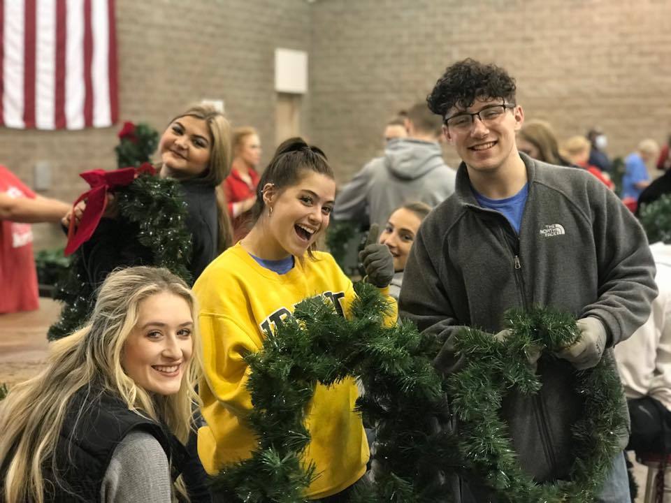 students and a Christmas tree