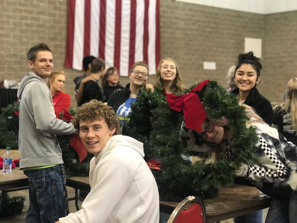 students and a Christmas tree